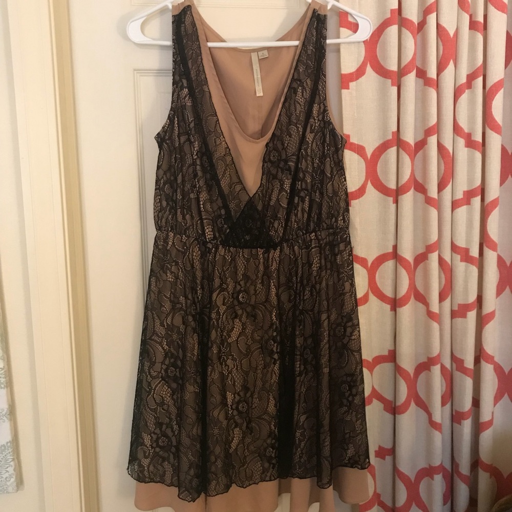 Cute blank lace over nude silk cocktail dress.